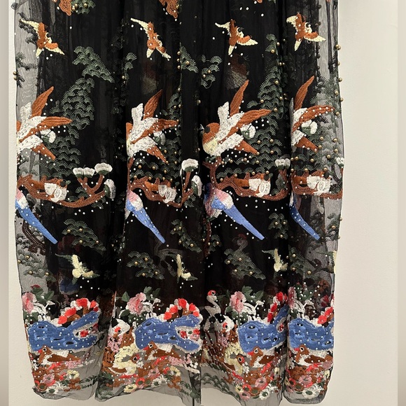 Vibrant beaded dress with a nature scene and she arms - Picture 5 of 11